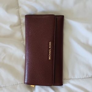 Michael kors burgundy Bi Fold wallet.
